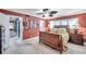 Bedroom with shutters, earth-toned walls, and a wood sleigh bed at 3898 49Th S Ave, St Petersburg, FL 33711