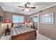 Bedroom featuring a ceiling fan, mirrored closet, and shuttered windows at 3898 49Th S Ave, St Petersburg, FL 33711