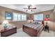 Cozy bedroom with shuttered windows, warm colors, and classic furnishings at 3898 49Th S Ave, St Petersburg, FL 33711