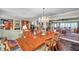 Elegant dining room with a chandelier, hardwood table and chairs, complemented by a decorative area rug at 3898 49Th S Ave, St Petersburg, FL 33711