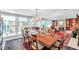 Elegant dining room featuring large windows, a chandelier, and classic furniture at 3898 49Th S Ave, St Petersburg, FL 33711