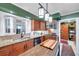 Well-lit kitchen with granite countertops, stainless steel appliances, and a modern faucet at 3898 49Th S Ave, St Petersburg, FL 33711