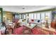 Bright living room with large windows, tiled floors, comfortable seating, and stylish decor at 3898 49Th S Ave, St Petersburg, FL 33711
