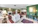 Spacious living room with fireplace, tiled floors, multiple seating areas, and an open floor plan at 3898 49Th S Ave, St Petersburg, FL 33711