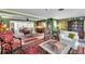 Spacious living room with large windows, traditional decor, and an adjacent dining area at 3898 49Th S Ave, St Petersburg, FL 33711