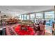 Inviting living room with large windows, dining area, and beautiful red rug provides a cozy living space at 3898 49Th S Ave, St Petersburg, FL 33711