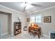 Bright office space with neutral walls, built-in shelving, and a ceiling fan at 3898 49Th S Ave, St Petersburg, FL 33711