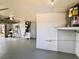 Bright garage with painted floor, utility system, and ample space for parking and storage at 3902 Glissade Dr, New Port Richey, FL 34652