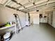 This garage features new gray paint and lots of room for storage at 3902 Glissade Dr, New Port Richey, FL 34652