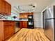 Modern kitchen featuring wood cabinets, stainless steel appliances, and ample storage at 3902 Glissade Dr, New Port Richey, FL 34652