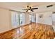 Open living area with wood floors, neutral walls, and plenty of natural light at 3902 Glissade Dr, New Port Richey, FL 34652
