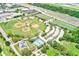 Aerial view of community athletic complex with baseball fields and tennis courts at 3928 E Eden Roc Cir, Tampa, FL 33634
