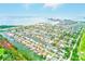 Breathtaking aerial view of waterfront homes with private boat docks in a beautiful coastal community near the ocean at 3928 E Eden Roc Cir, Tampa, FL 33634