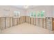 Bright bedroom with tile floors, two windows and easy access to other parts of the home at 3928 E Eden Roc Cir, Tampa, FL 33634