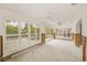 Sunroom showcasing white plantation shutters, sliding glass doors and access to the pool at 3928 E Eden Roc Cir, Tampa, FL 33634