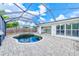 Enclosed pool area with a screened enclosure, and a large patio at 3928 E Eden Roc Cir, Tampa, FL 33634