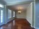 Bright dining room featuring hardwood floors, modern lighting fixture, and neutral paint for a contemporary look at 405 Islebay Dr, Apollo Beach, FL 33572