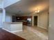 Open kitchen with stainless steel appliances, granite countertops, and tile flooring at 405 Islebay Dr, Apollo Beach, FL 33572