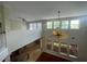 Open concept living area with soaring ceilings and lots of natural light from large windows at 405 Islebay Dr, Apollo Beach, FL 33572