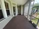 View of screen enclosed porch showing an outdoor sitting area and a door to the outside at 405 Islebay Dr, Apollo Beach, FL 33572