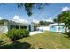 Well-maintained backyard featuring green lawn, a shed, and hardscaped patio area with chairs for relaxing at 4718 24Th S Ave, St Petersburg, FL 33711