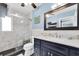 Stylish bathroom featuring a modern vanity, walk-in shower, and elegant tile accents at 4718 24Th S Ave, St Petersburg, FL 33711