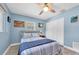 Light-filled bedroom with calming blue walls, a ceiling fan and large closet space at 4718 24Th S Ave, St Petersburg, FL 33711