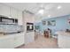 Well-equipped kitchen featuring stainless steel appliances, white cabinets, and an open layout at 4718 24Th S Ave, St Petersburg, FL 33711