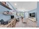 Spacious living room with a home office space, light-blue walls, and plenty of natural light at 4718 24Th S Ave, St Petersburg, FL 33711