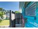 Outdoor shower adjacent to a painted mural wall and view of the landscaped backyard at 4718 24Th S Ave, St Petersburg, FL 33711