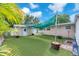 This backyard has artificial turf and a shade at 4731 W Leila Ave, Tampa, FL 33616
