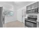 This kitchen has stainless steel appliances and plenty of natural light at 4731 W Leila Ave, Tampa, FL 33616