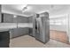 The kitchen includes stainless steel appliances and a view into another room at 4731 W Leila Ave, Tampa, FL 33616