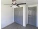 Cozy bedroom featuring a ceiling fan, and closet at 4823 Ashland Dr, Tampa, FL 33610