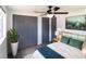 Bright bedroom featuring a ceiling fan, and closet at 4823 Ashland Dr, Tampa, FL 33610
