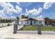 Well-maintained single-story home with fresh exterior paint and landscaping on a sunny day at 4823 Ashland Dr, Tampa, FL 33610