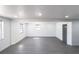 Bright, spacious living room featuring recessed lighting and modern gray floors at 4823 Ashland Dr, Tampa, FL 33610