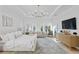 Expansive bedroom with sitting area, tray ceilings, modern chandelier, and outside view at 503 W Davis Blvd, Tampa, FL 33606