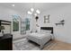Fun bedroom with stylish furnishings, a modern light fixture, and hardwood floors at 503 W Davis Blvd, Tampa, FL 33606