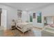 Cozy bedroom featuring neutral color, light hardwood floor and matching area rug at 503 W Davis Blvd, Tampa, FL 33606