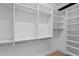 Walk-in closet with custom shelves and rods, maximizing storage space at 503 W Davis Blvd, Tampa, FL 33606