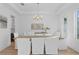 Bright dining room features a modern chandelier, stylish decor, and ample seating for gatherings at 503 W Davis Blvd, Tampa, FL 33606