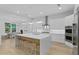 Modern kitchen featuring stainless steel appliances, a large center island, and ample counter space at 503 W Davis Blvd, Tampa, FL 33606