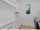 Laundry room with sleek countertops, cabinets and modern washer and dryer at 503 W Davis Blvd, Tampa, FL 33606