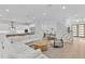 Open-concept living room with a modern staircase, a comfortable sectional, and stylish finishes at 503 W Davis Blvd, Tampa, FL 33606
