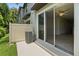 A private back patio with sliding glass doors, offering a seamless indoor-outdoor living experience at 5110 Sylvester Loop, Tampa, FL 33610