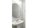 Powder room features a pedestal sink, mirror and chrome accents at 5110 Sylvester Loop, Tampa, FL 33610