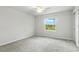 Bright bedroom with a ceiling fan and a large window with natural light at 5110 Sylvester Loop, Tampa, FL 33610