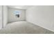 Bedroom with neutral walls, carpeted floors and a window with natural light at 5110 Sylvester Loop, Tampa, FL 33610