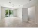 Spacious bedroom with tile flooring, fan, and sliding glass doors leading to the outside at 5110 Sylvester Loop, Tampa, FL 33610